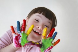 Cute little girl with painted hands